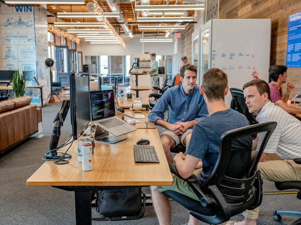 Team working in an office where AI agents handle routine tasks