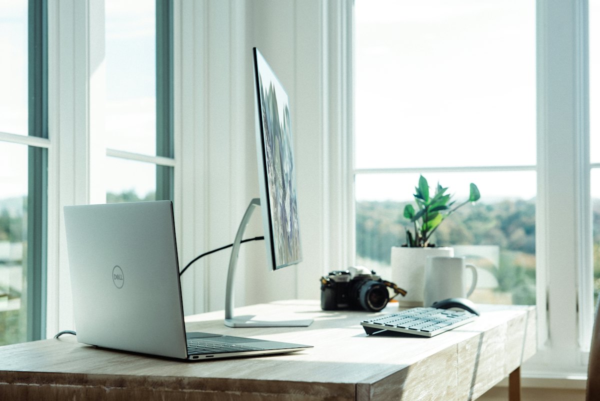 Clean desk with laptop, ready to start